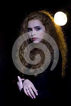 Studio portrait of beautiful young model on black background