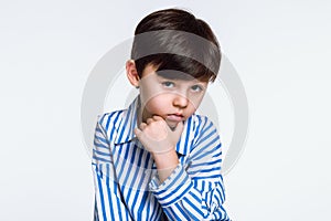Studio portrait of a boy with serious worries