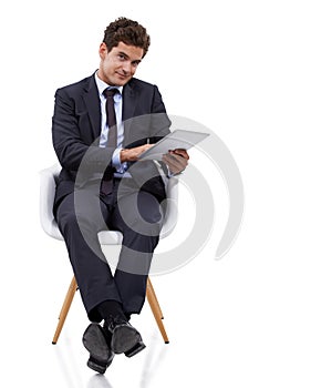 Studio, portrait and businessman with tablet in chair, working as manager in social media or networking. Tech