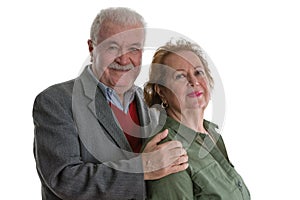 Studio portrait of cheerful senior couple