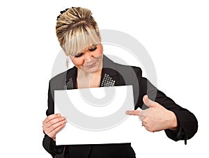 Studio portrait of a cute blond girl holding a piece of paper