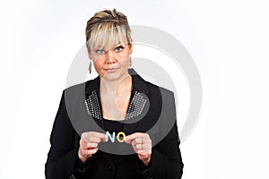 Studio portrait of a cute blond girl holding two letters forming