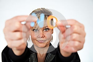 Studio portrait of a cute blond girl holding two letters forming