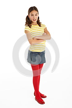 Studio Portrait Of Defiant Young Girl