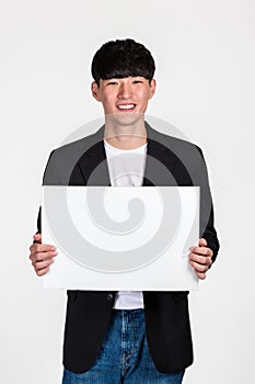 Studio portrait of an East Asian business man doing various pose with whiteboard