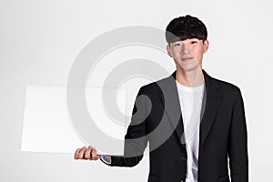 Studio portrait of an East Asian business man doing various pose with whiteboard