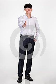 A studio portrait of an East Asian business man pointing at something and posing for a variety of poses