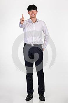 A studio portrait of an East Asian business man pointing at something and posing for a variety of poses