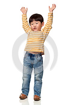 Studio portrait of an East Asian male child with both hands open