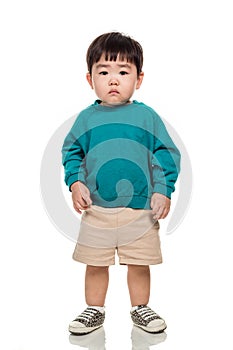 Studio portrait of an East Asian young child with a serious look on a white background