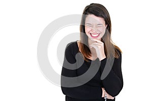 Studio portrait of an excited young woman closed eyes