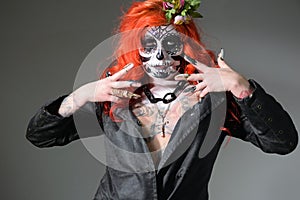 Studio portrait of female model with sugar skull makeup