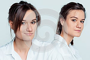 Studio portrait of female twins