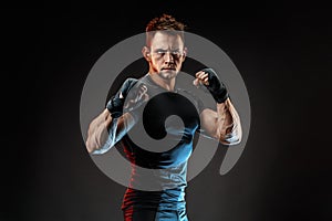 Studio portrait of fighting muscular man