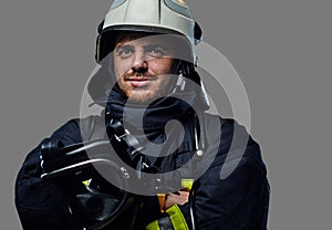 Studio portrait of firefighter dressed in uniform.