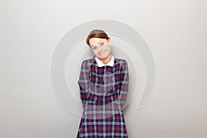 Portrait of funny confused young woman making silly goofy face