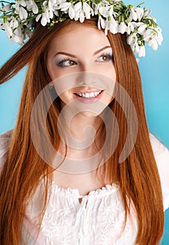 Studio portrait of a girl in wreath of flowers