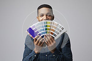 Studio Portrait Of Graphic Designer With Color Swatches