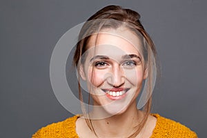 Studio portrait of happy, natural glowing beautiful woman expressing wellness