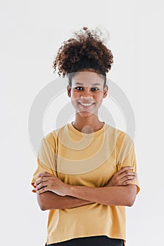 Studio portrait of happy successful confident black business woman. Beautiful young African American woman in yellow t