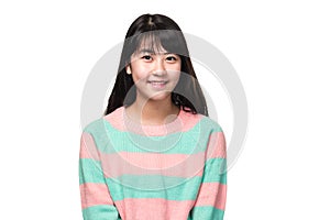 Studio portrait of happy teenage East Asian woman in white background