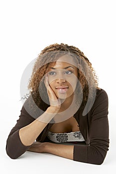 Studio Portrait Of Happy Teenage Girl