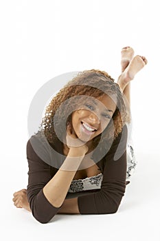 Studio Portrait Of Happy Teenage Girl