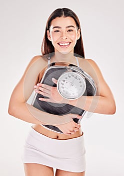 Studio, portrait or happy woman with smile or scale for body training or gym workout to lose weight. Fitness, hug and