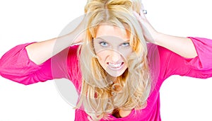 Studio portrait of a hysterical long blond girl