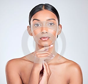 Studio portrait of Indian woman for skincare, beauty and cosmetics on white background for salon aesthetic. Dermatology