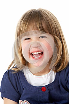 Studio Portrait Of Laughing Young Girl