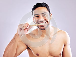 Studio, portrait and man with toothbrush for teeth, wash and routine of hygiene in morning and dental. Oral health