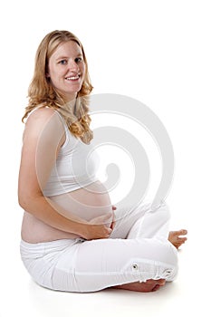 Studio portrait of pregnant woman over white background