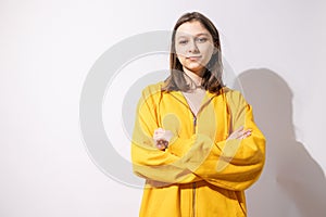 Studio portrait of pretty young teenage girl posing on white background.