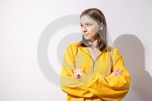 Studio portrait of pretty young teenage girl posing on white background.