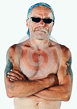 Studio portrait of a shirtless construction worker wearing a bandana