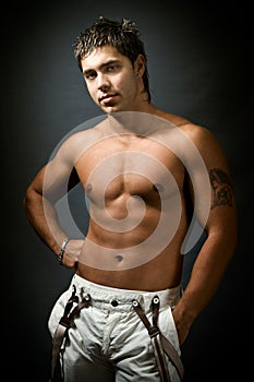 Studio portrait of shirtless muscular man