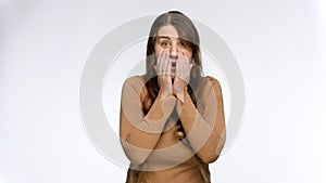 Studio portrait of shocked and amazed woman saying wow. Positive emotions and surprised face expression