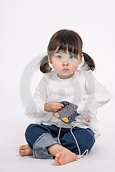 Studio portrait shot of 3-year-old Asian baby - isolated