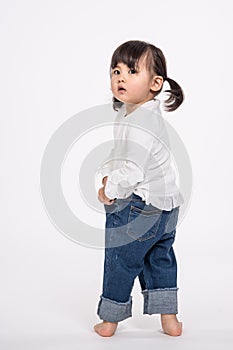 Studio portrait shot of 3-year-old Asian baby - isolated