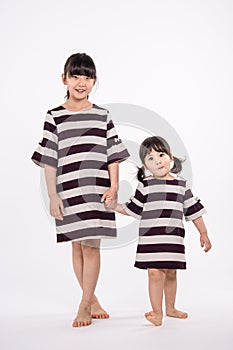 Studio portrait shot of 3-year-old Asian baby - isolated