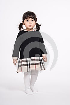 Studio portrait shot of 3-year-old Asian baby - isolated
