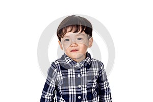 Studio portrait of sincere but mischievous asian boy child