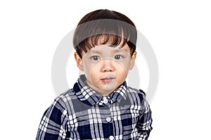 Studio portrait of sincere but mischievous asian boy child