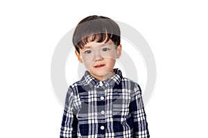 Studio portrait of sincere but mischievous asian boy child