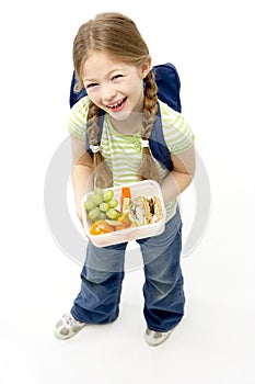 Studio Portrait of Smiling Girl Holding Lunchbox