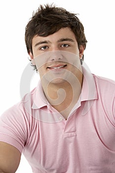 Studio Portrait Of Smiling Teenage Boy