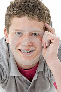 Studio Portrait of Smiling Teenage Boy