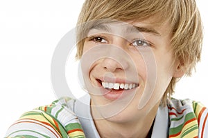 Studio Portrait Of Smiling Teenage Boy