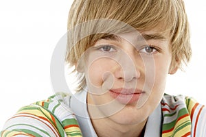 Studio Portrait Of Smiling Teenage Boy